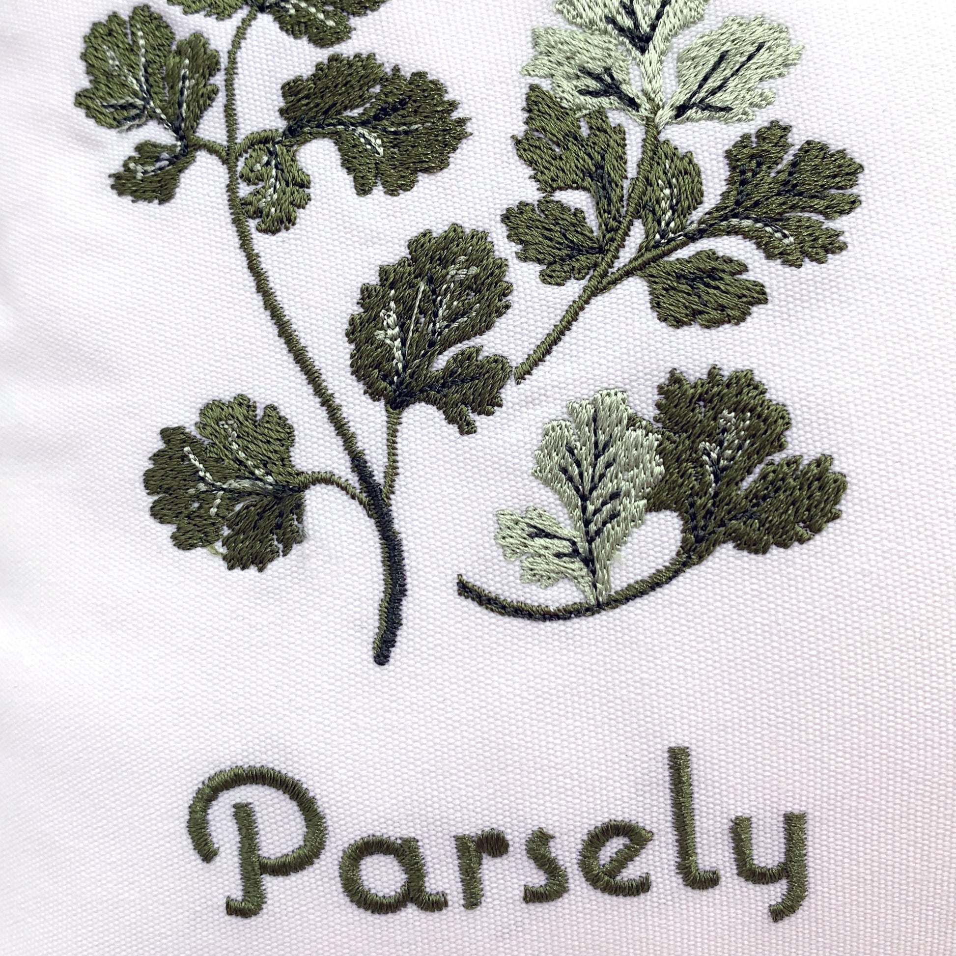 Detail shot of the Herb Garden pillows embroidery