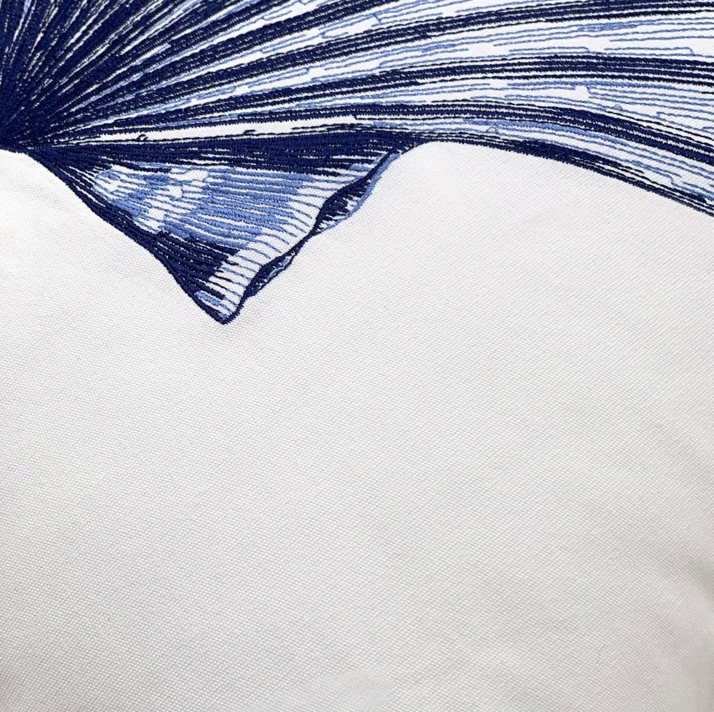 Detail shot of the Indigo Scallop Shell pillow's emboirdery.