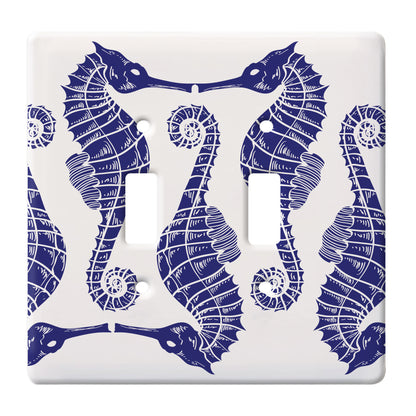 ceramic white double toggle switch plate featuring alternating blue seahorse pattern.