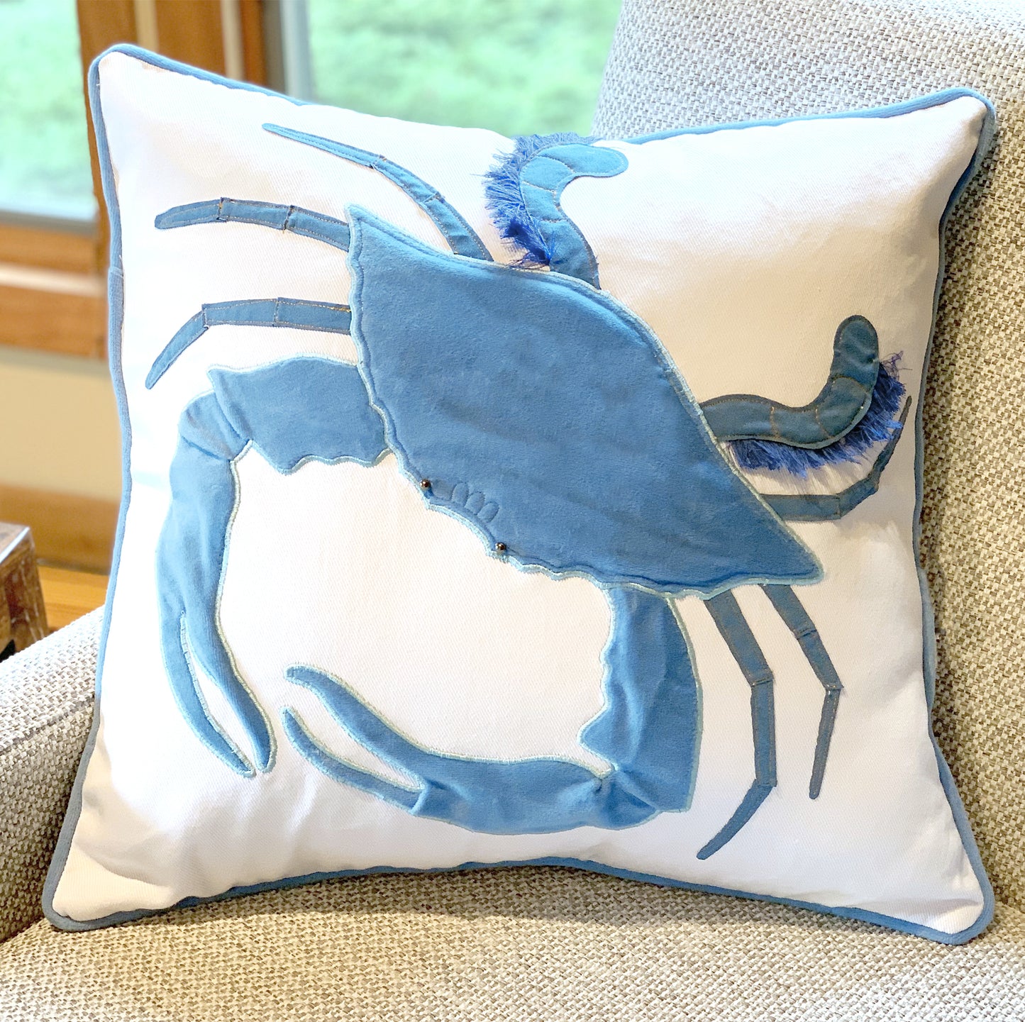 King of the Chesapeake Velvet pillow styled on a tweed chair.