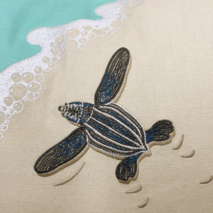 Detail shot of the Leatherback Turtle Pillows embroidery.