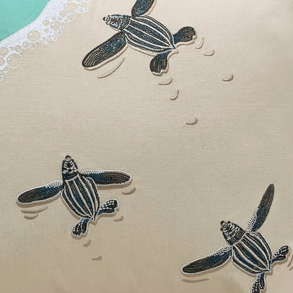 Detail shot of the Leatherback Turtle Pillows embroidery.