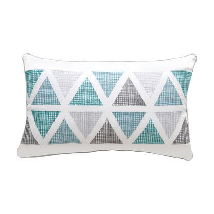 Triangles of teal, blue, and grey form a modern geometric pattern on a white background. Pillow is finished with grey piped edging.