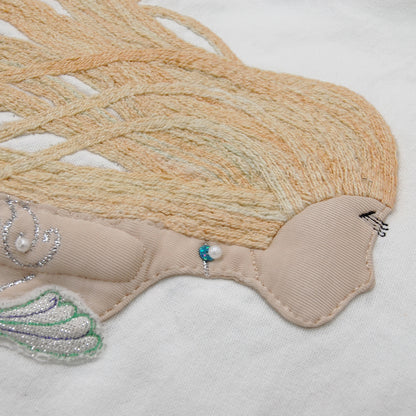 Detailed shot of the Pearl of the Sea Mermaid pillow.