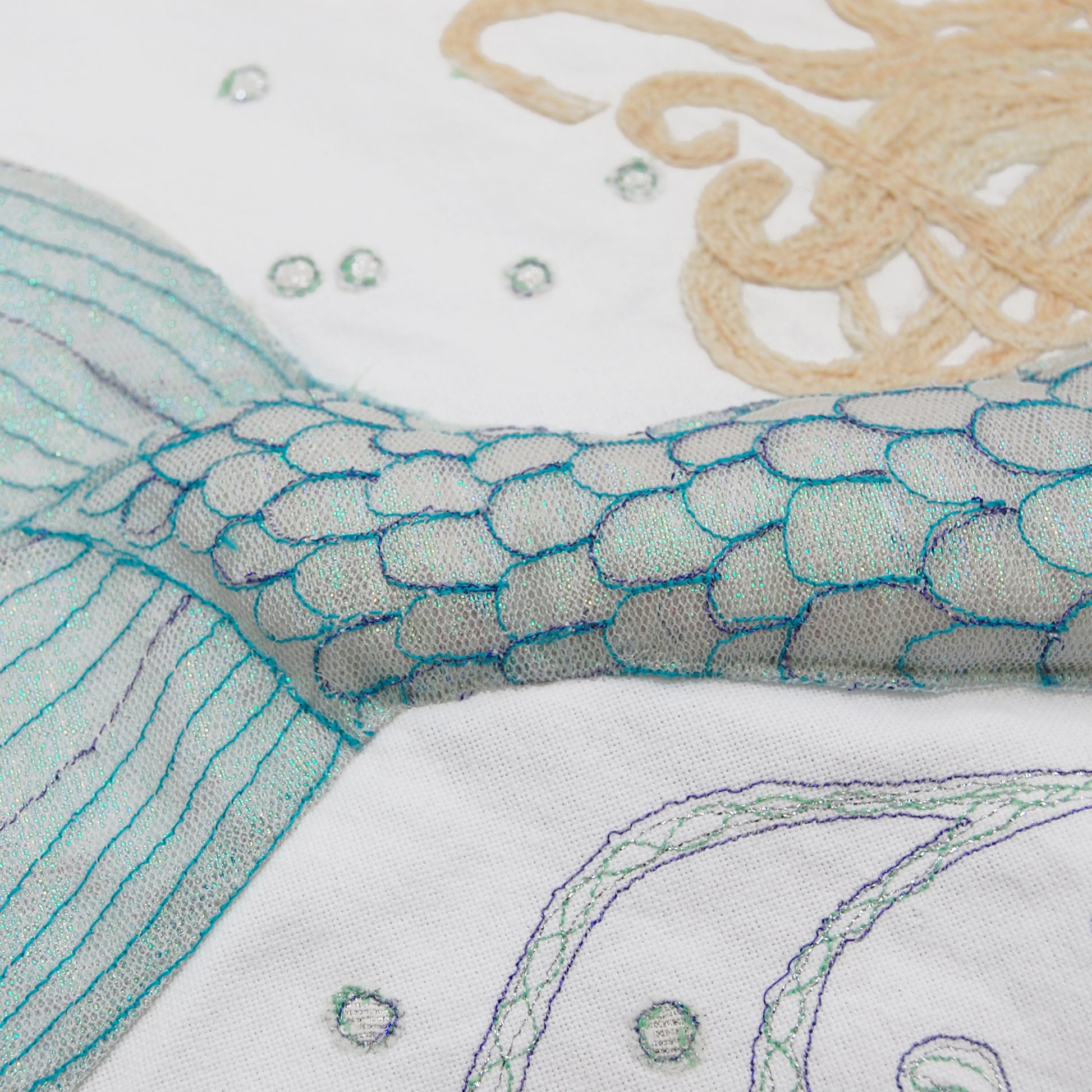 Detailed shot of the Pearl of the Sea Mermaid pillow.