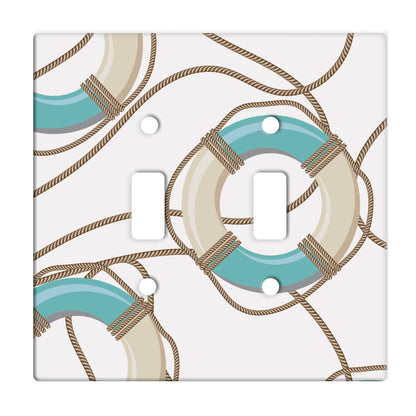 white ceramic double toggle switch plate featuring graphic of ropes and white and teal life preservers.