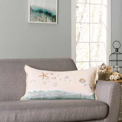 Sand and Shells Fringed Lumbar Pillow styled in a coastal living room.