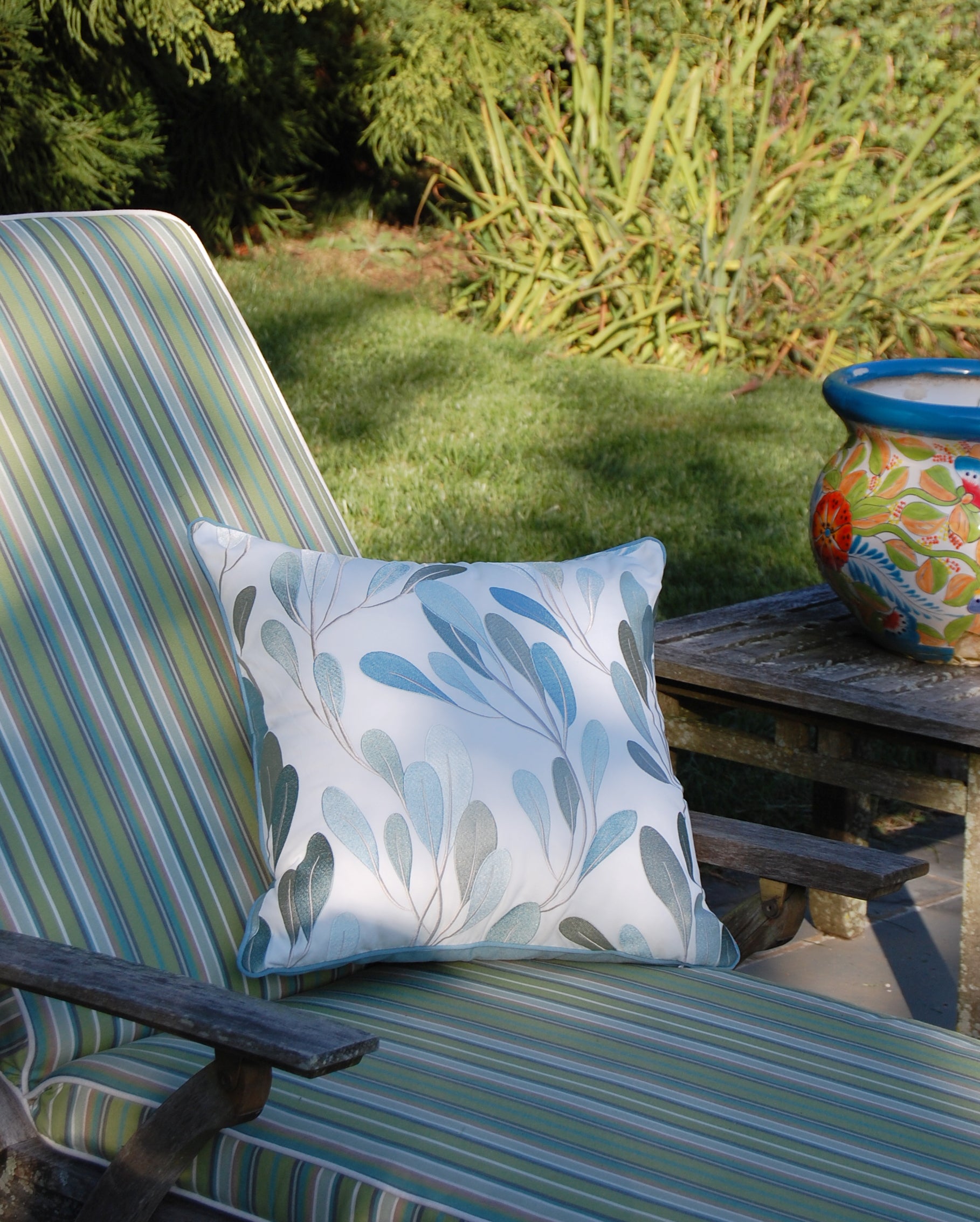 Sea Vine Indoor Outdoor Pillow styled on a lounge hair.