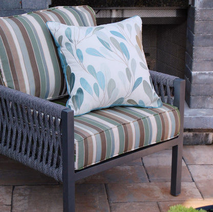 Sea Vine Indoor Outdoor Pillow styled on a patio chair.