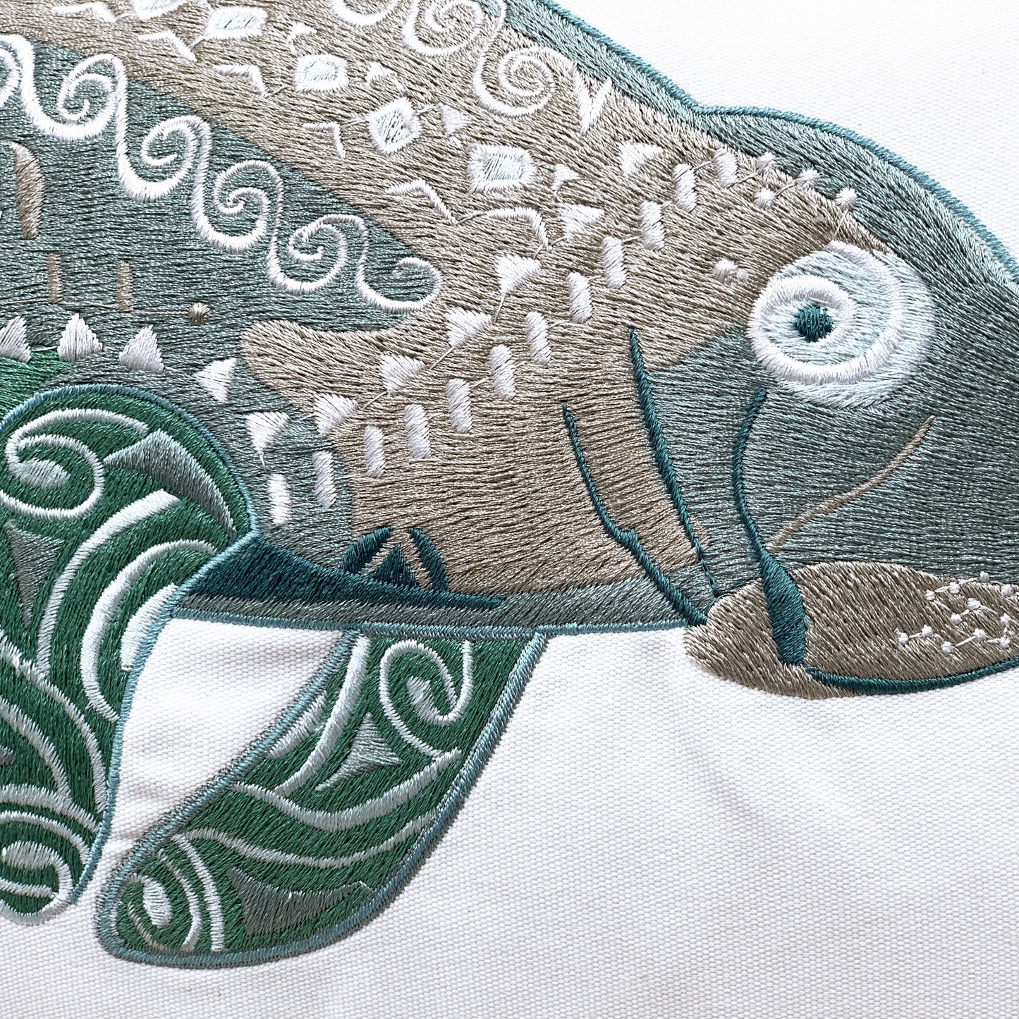 Detailed shot of the Seaglass Tribal Manatee Indoor Outdoor pillow.