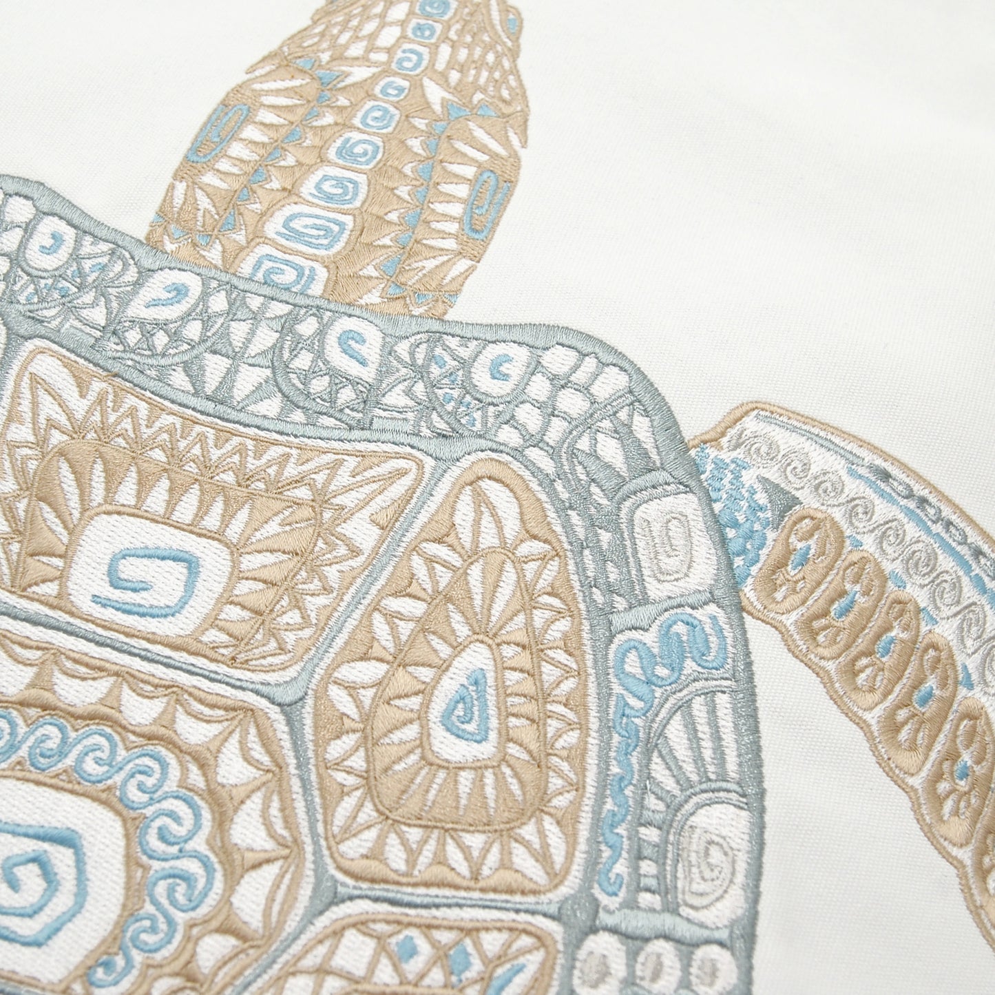 Detailed shot of the SEAGLASS TRIBAL TURTLE INDOOR OUTDOOR PILLOW