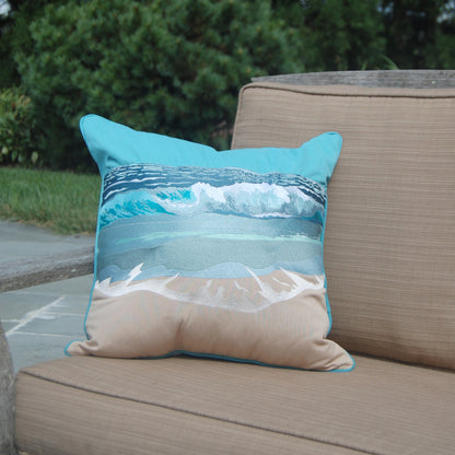 Surf Breaker Indoor Outdoor pillow styled on a patio chair.