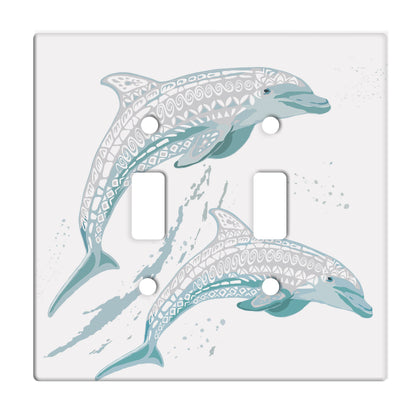 white ceramic double toggle switch plate featuring two teal dolphins.