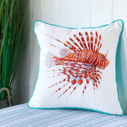 Tropical Punch Lionfish Indoor Outdoor Pillow styled on a fabric bench.