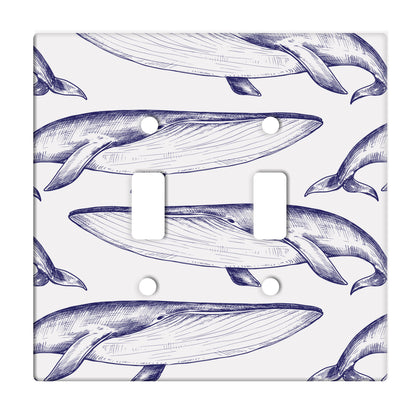 white ceramic double toggle switch plate featuring alternating pattern of navy whales.