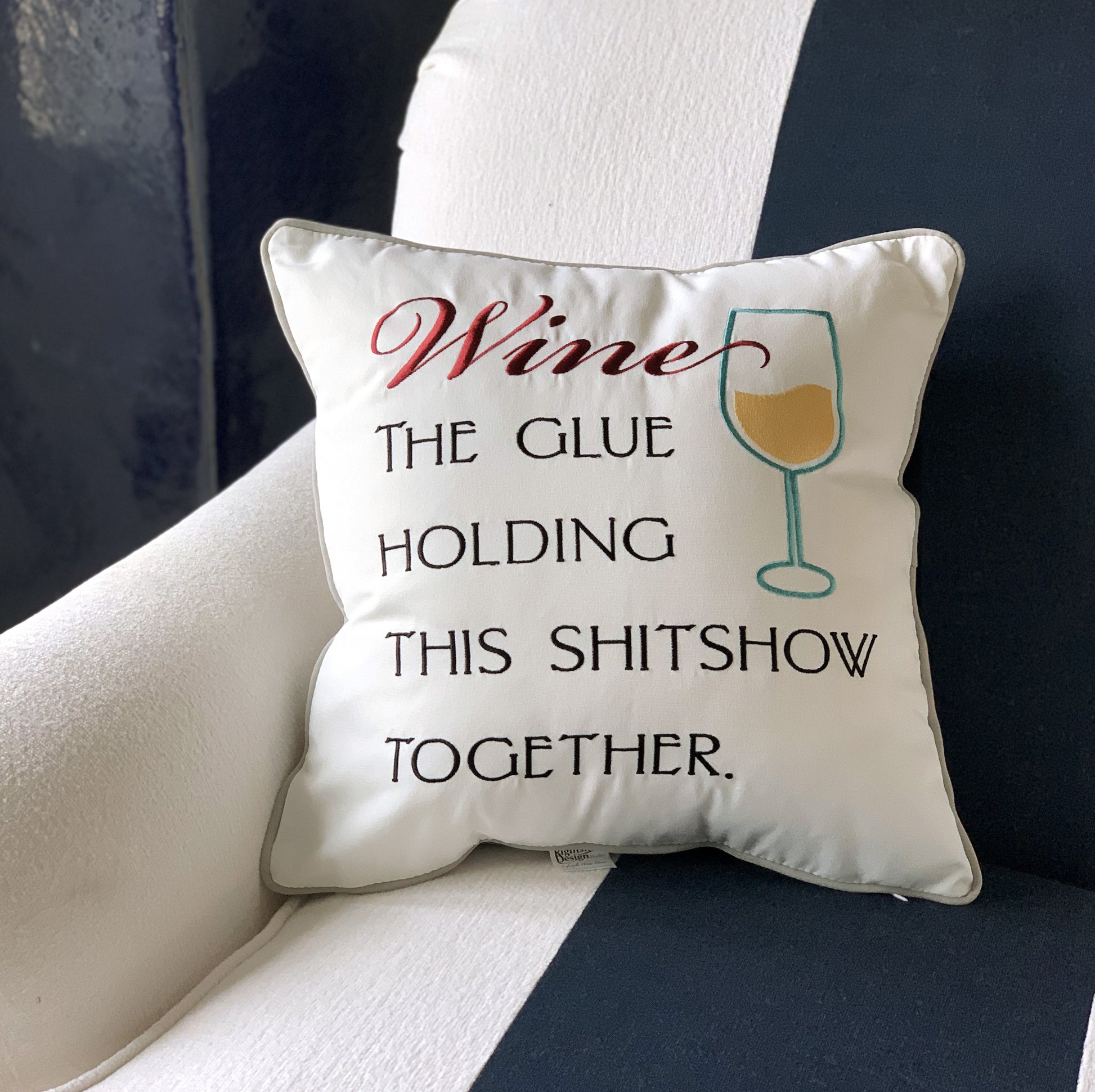 Wine Inspirations Indoor Outdoor Pillow styled on a chair.