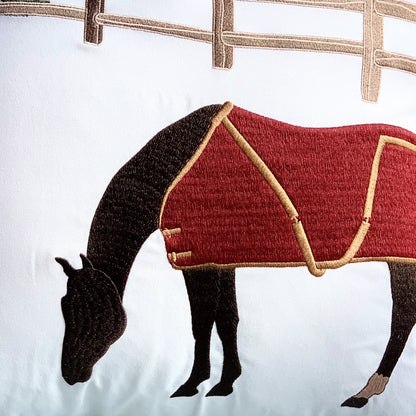 Detail shot of the horse on the Winter Chill Neutral Indoor Outdoor pillow.