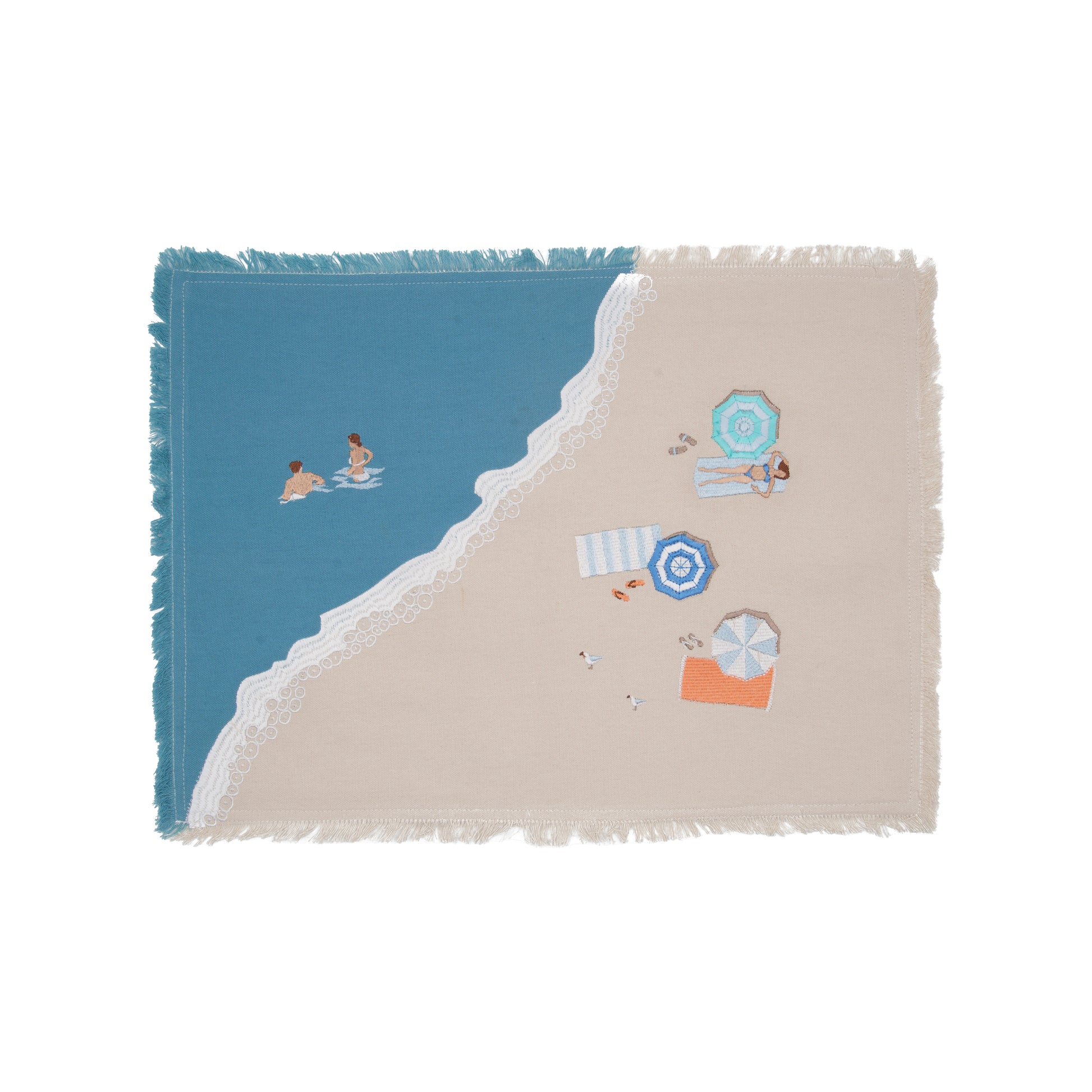 Colorful beach umbrellas, towels, and sun bathers embroidered on a sandy beach scene of natural and blue cotton on a fringed placemat.