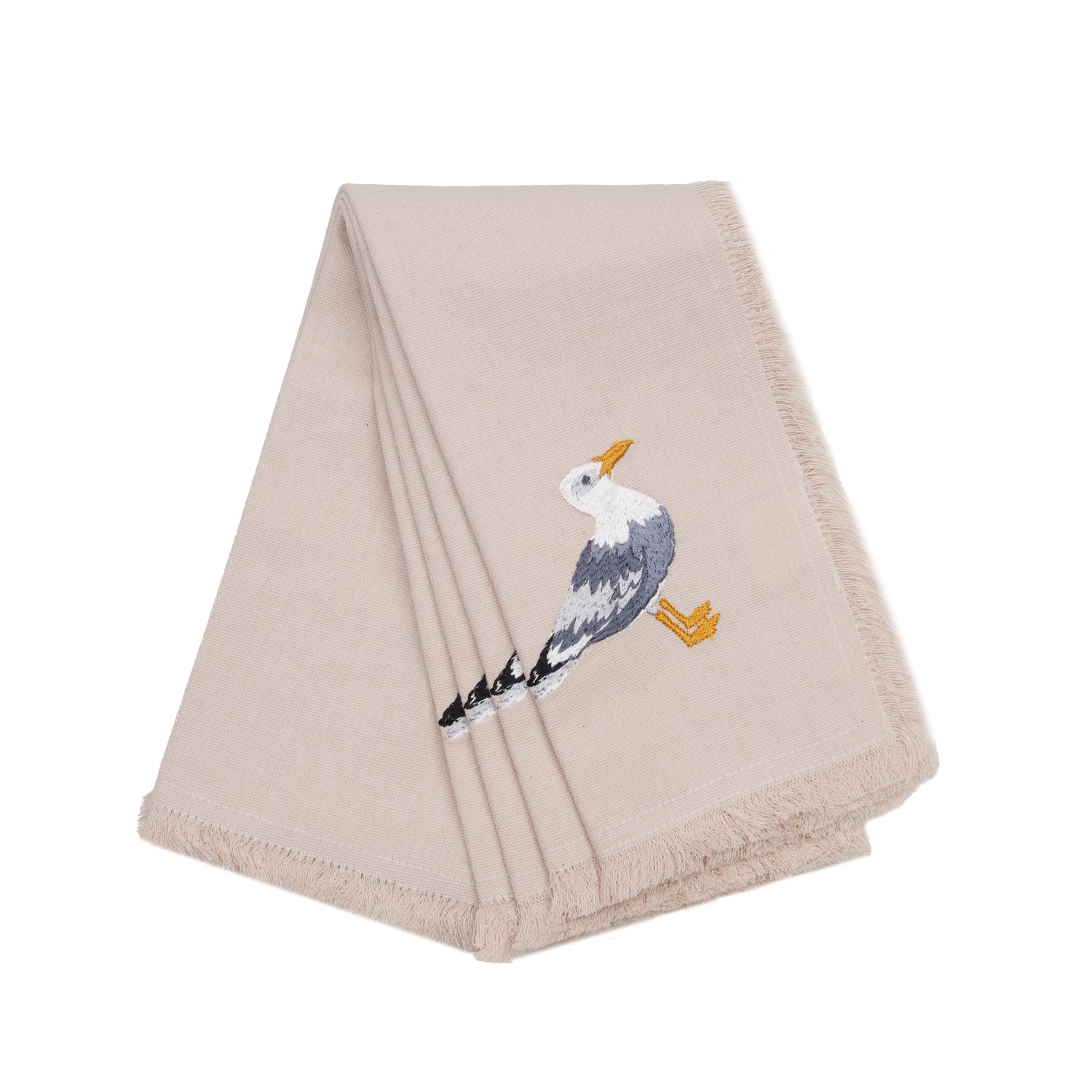 Sea gull embroidered on natural cotton fringed napkins.